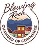 Blowing Rock Chamber of Commerce logo with mountains, buildings, and river tubing in a circular frame.