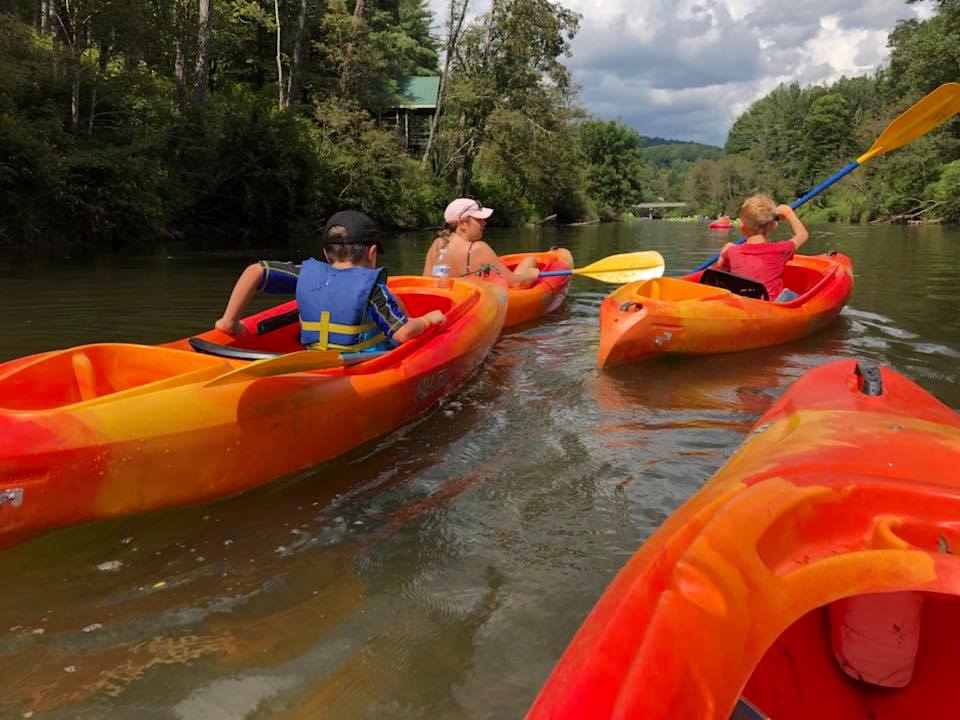 a group of people on a boat in the water